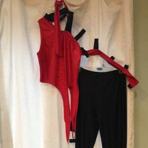 Red shirt with torn sleeve and black dance pants